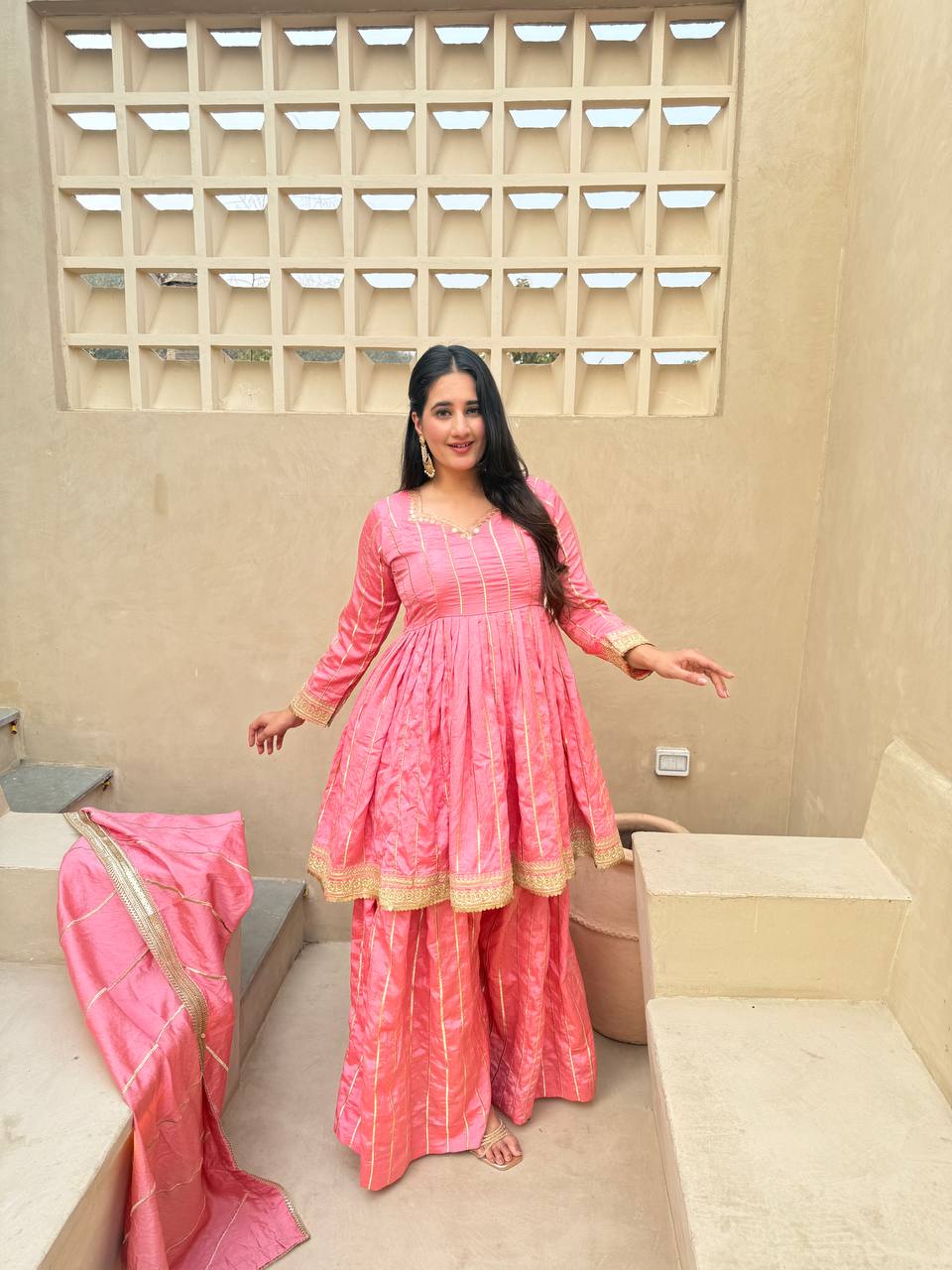 Radiant Rose Pink Flared Peplum Kurti and Sharara Set Embellished with Luminous Gold Zari Stripes and Sequined Borders